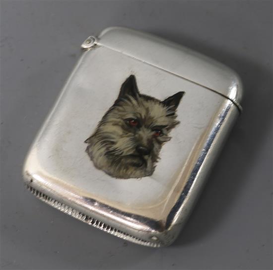 A late Victorian silver vesta case enamelled with the head of a terrier, Hayes Brothers, Birmingham, 1894, 45mm.